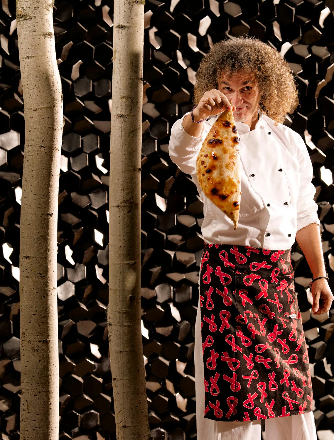 A chef presenting Calzone Dolce at Park Hotel in Athens.